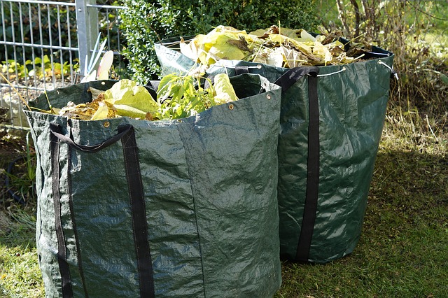 Garden waste bags filled with leaves and clippings ready for removal